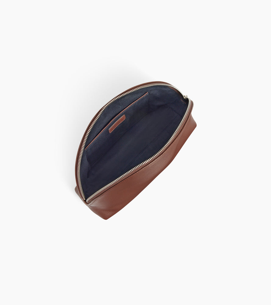 Half-moon toiletry bag in grained leather
